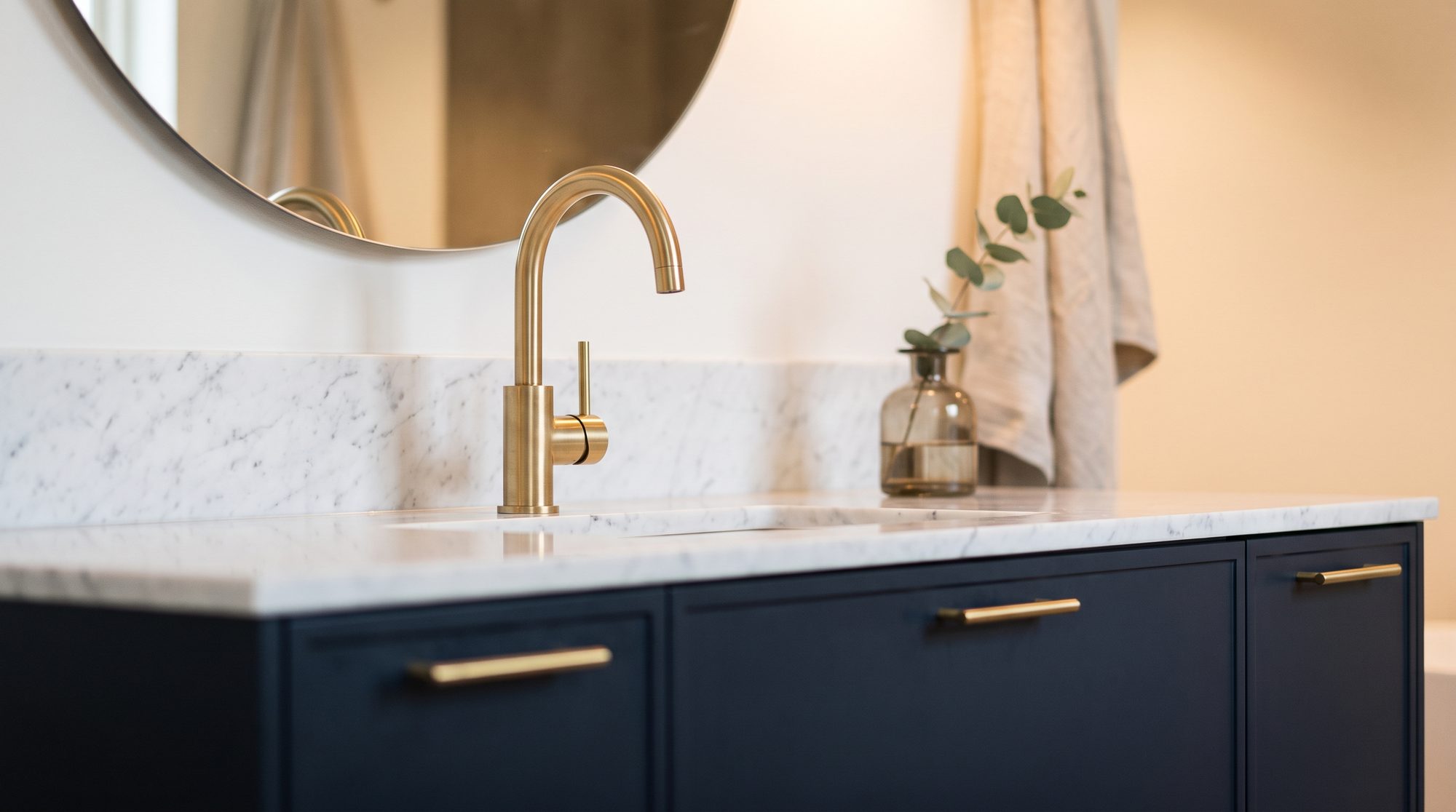 Navy joinery with a round mirror